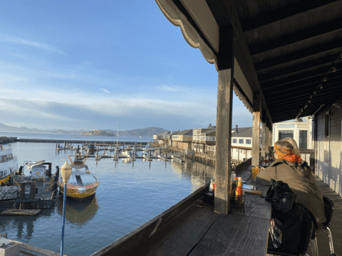 Diners enjoy the view of San Francisco Bay from the outdoor patio at Eagle Cafe